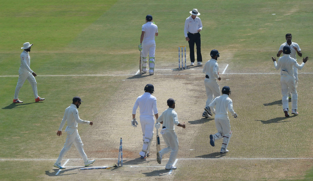 India's Ravichandran Ashwin (R) celebrates with teammates after England's Zafar Ansari (3L) was clean-bowled during the last day of the second Test cricket match between India and England at the Dr. Y.S. Rajasekhara Reddy ACA-VDCA Cricket Stadium in Visha