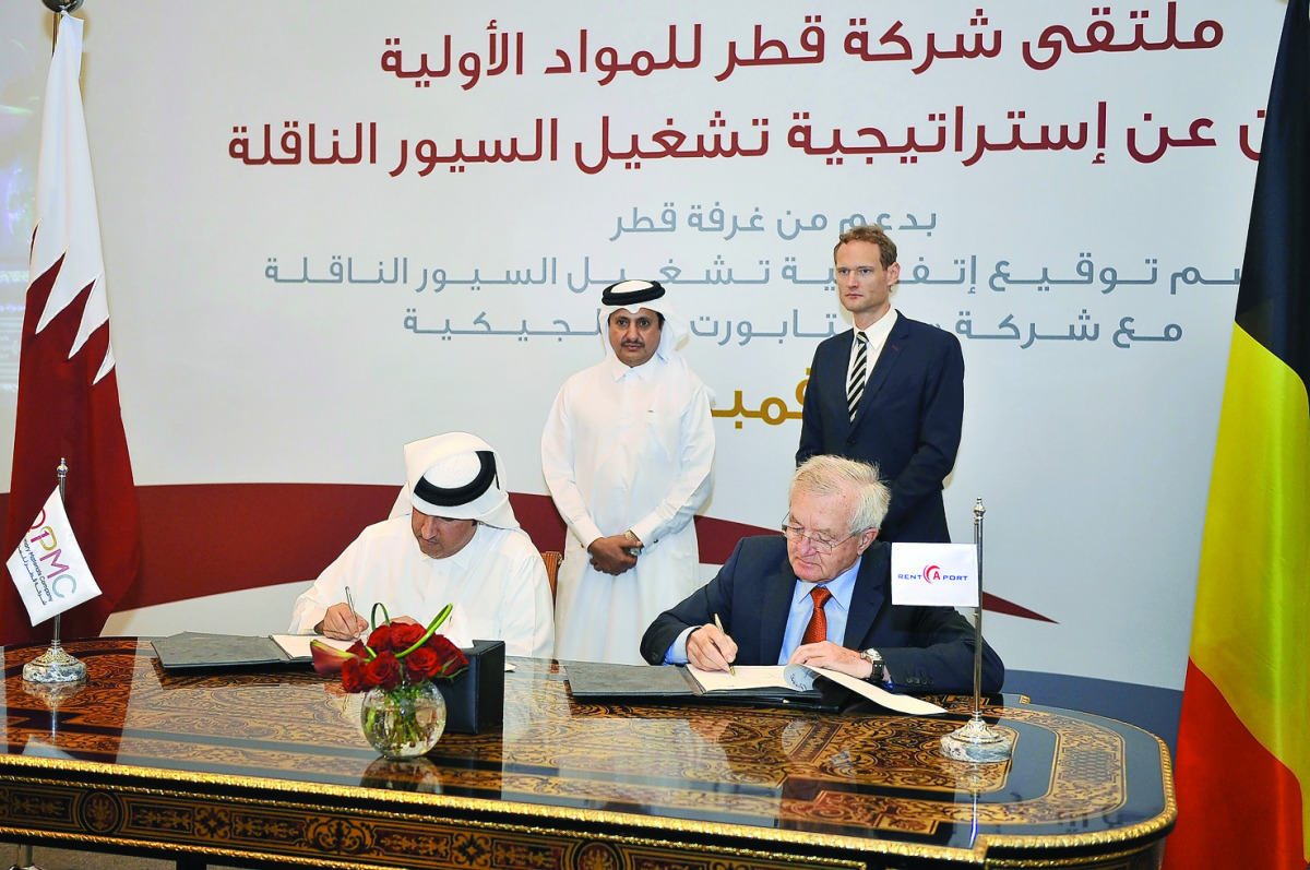 Eisa Al Hammadi, (left) QPMC Chief Executive Officer, and Marcel Van Bouwel, General Manager of Rent-A-Port, signing the contract in the presence of Sheikh Khalifa bin Jassim Al Thani and Christophe Payot, Ambassador of Belgium, in Doha yesterday. Pic:Ba