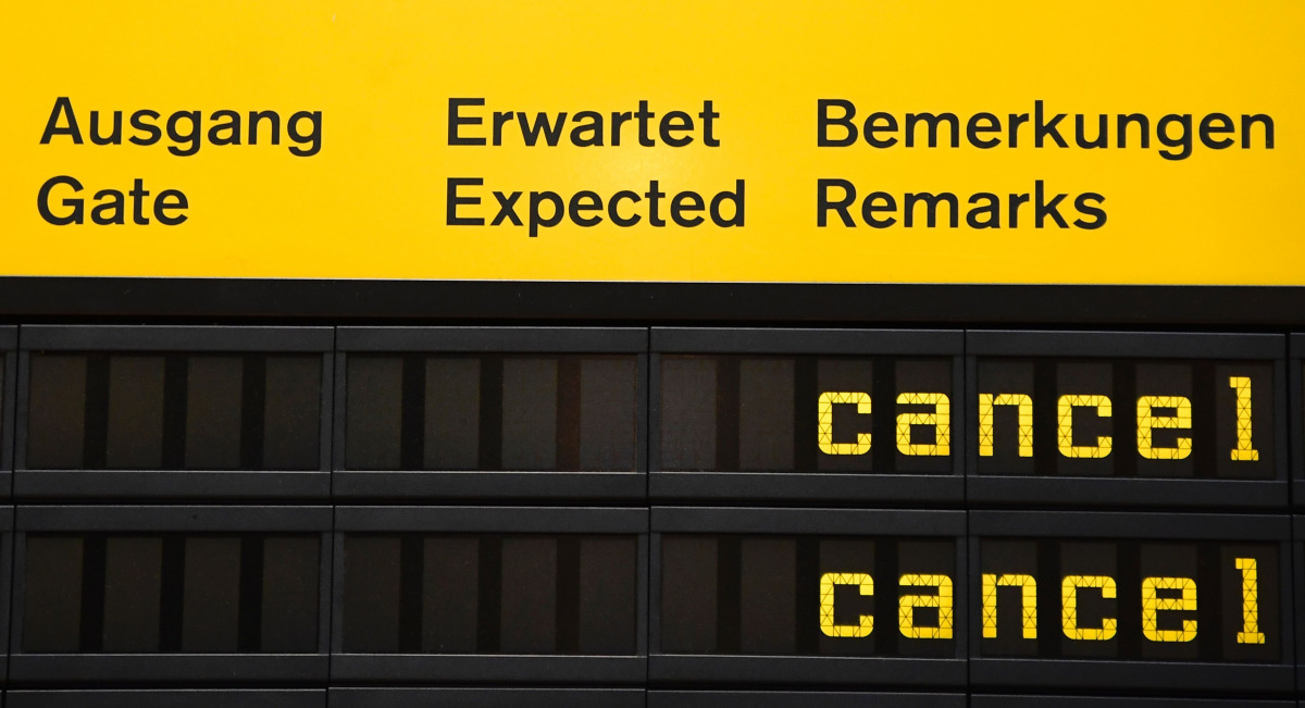 This file photo taken on October 27, 2016 shows an information board showing cancelled flights due to a one-day strike of German flight operator Eurowings at the Berlin Tegel airport Berlin. A strike by cabin crew at Lufthansa's low-cost airline Eurowings
