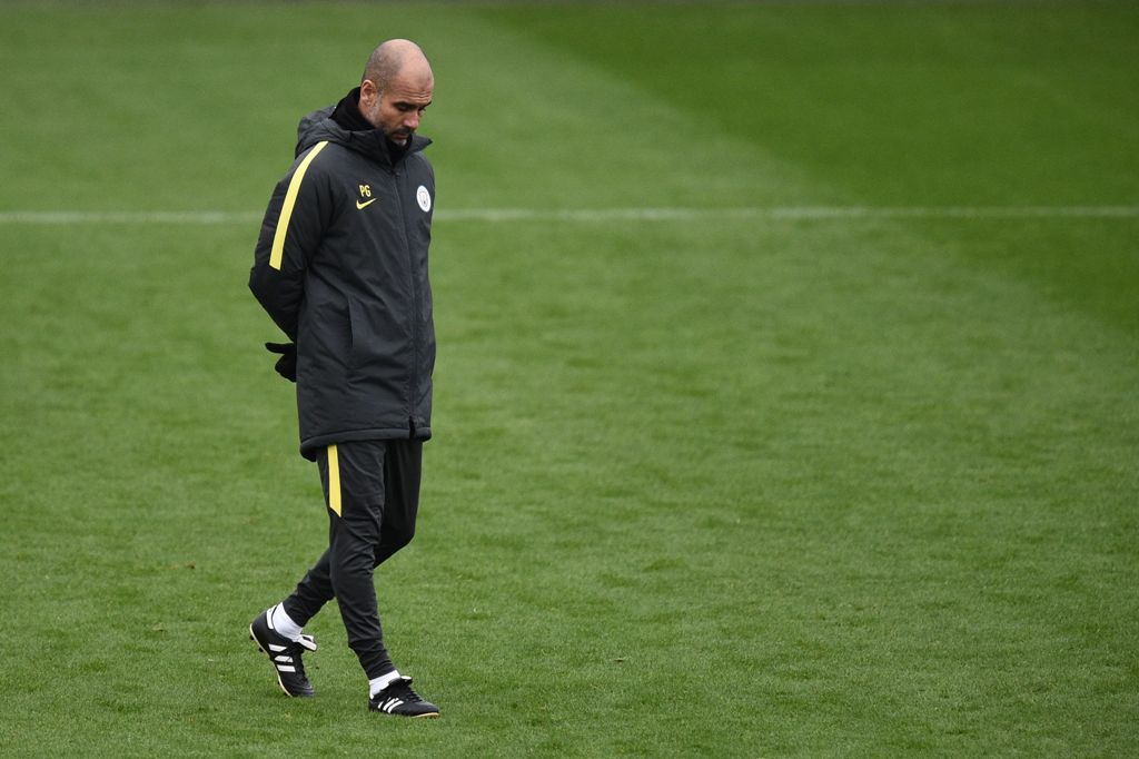 Manchester City's Spanish coach Pep Guardiola attends a training session at the City Football Academy in Manchester, northern England, on November 22, 2016.  AFP / OLI SCARFF
