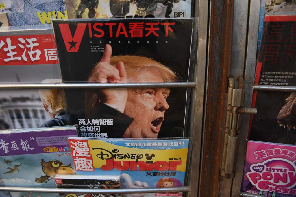 A magazine featuring a cover story about US President-elect Donald Trump is seen at a news stand in Beijing on November 23, 2016. AFP / GREG BAKER