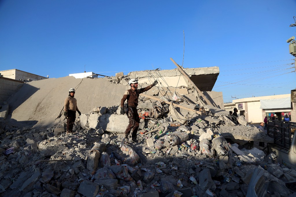 Debris of the collapsed buildings are seen after the war crafts belonging to the Syrian and Russian armies carried out airstrikes on the residential areas in Kafr Naya town of Aleppo, Syria on November 23, 2016. ( Beha el-Halebi - Anadolu Agency )
