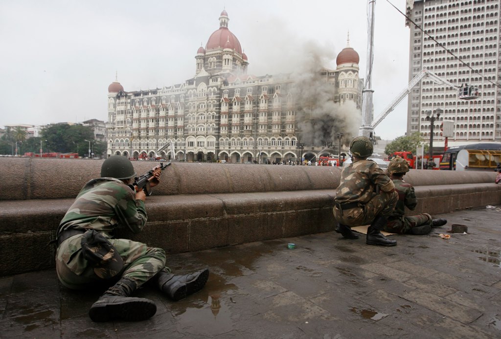 Indian army soldiers take position during a gun battle at the Taj Mahal hotel in Mumbai November 29, 2008. Reuters