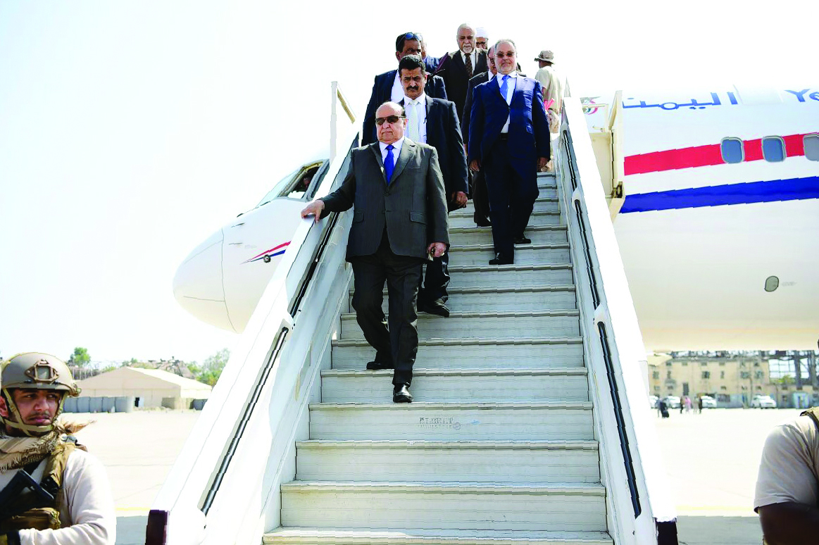 Yemeni President Abdrabuh Mansur Hadi disembarking from a plane upon his arrival at Aden airport, yesterday.