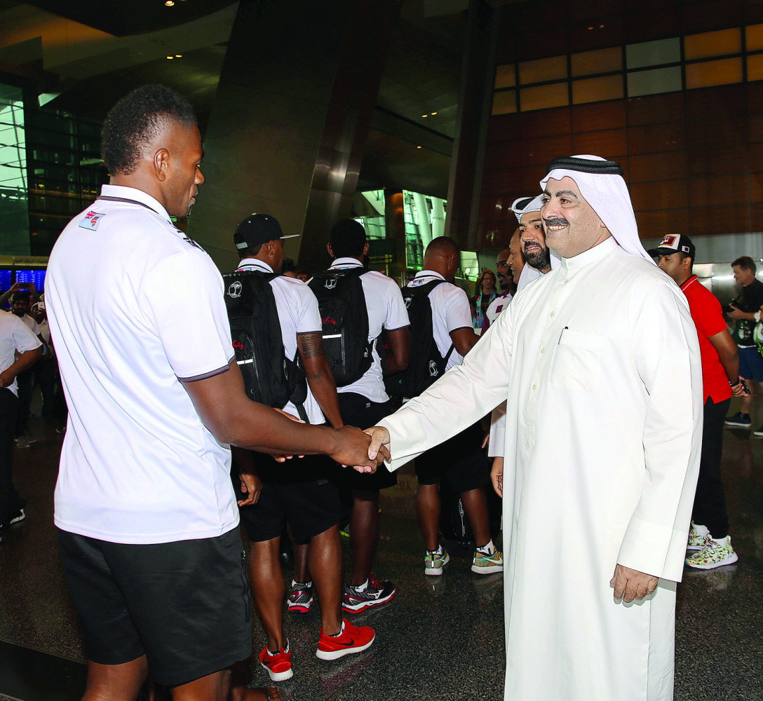 Qatar Rugby Federation's Yousef Al Kuwari receiving the Fiji team at the Hamad International Airport in Doha on Friday.