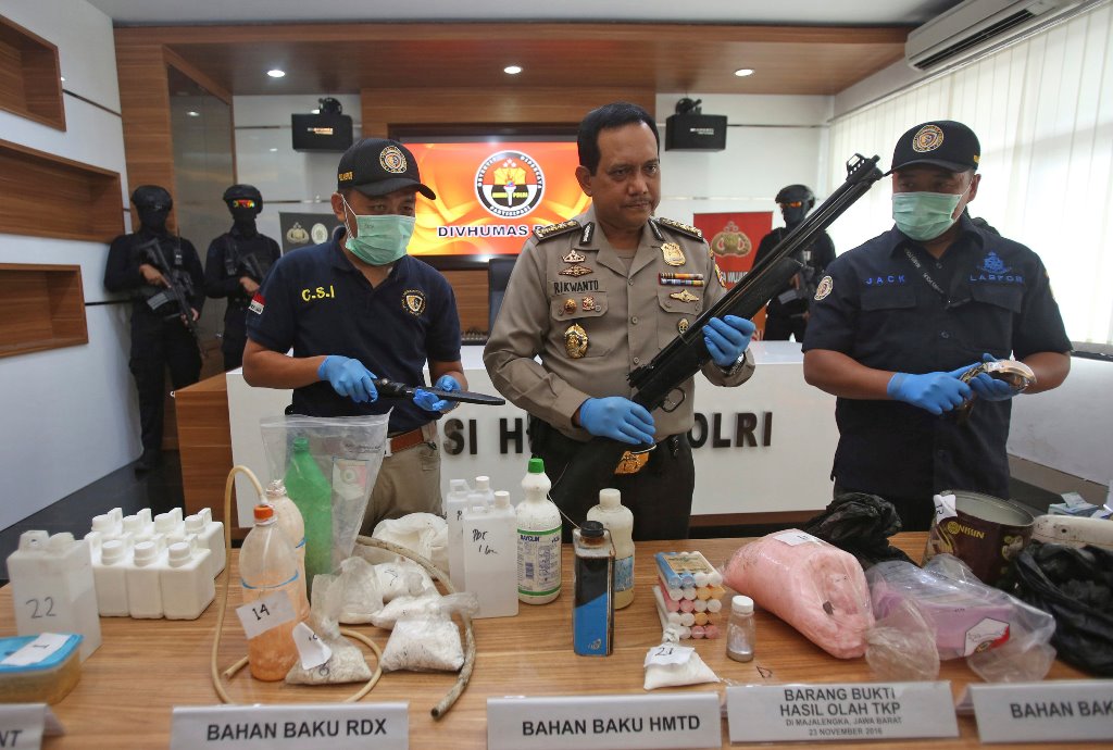 Indonesian police show items recently seized, including weapons and bomb-making materials, that they say were intended for use to attack government buildings and the Myanmar embassy, at police headquarters in Jakarta, Indonesia November 25, 2016 in this p