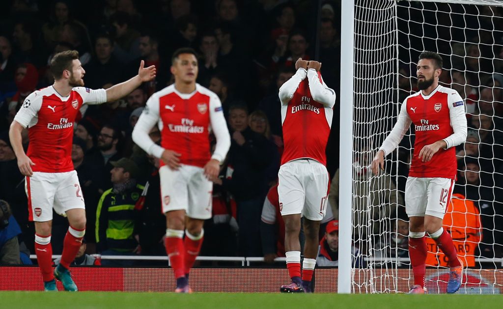 Arsenal's Nigerian striker Alex Iwobi (2R) reacts after deflecting the ball from Paris Saint-Germain's Brazilian midfielder Lucas Moura's header for Paris's second goal during the UEFA Champions League group A football match between Arsenal and Paris Sain