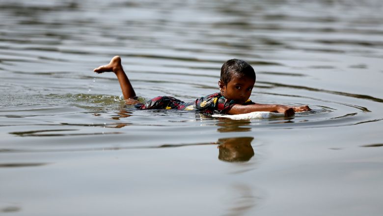 A child swims in a river in Dhaka, Bangladesh November 28, 2016. (REUTERS/Mohammad Ponir Hossain)