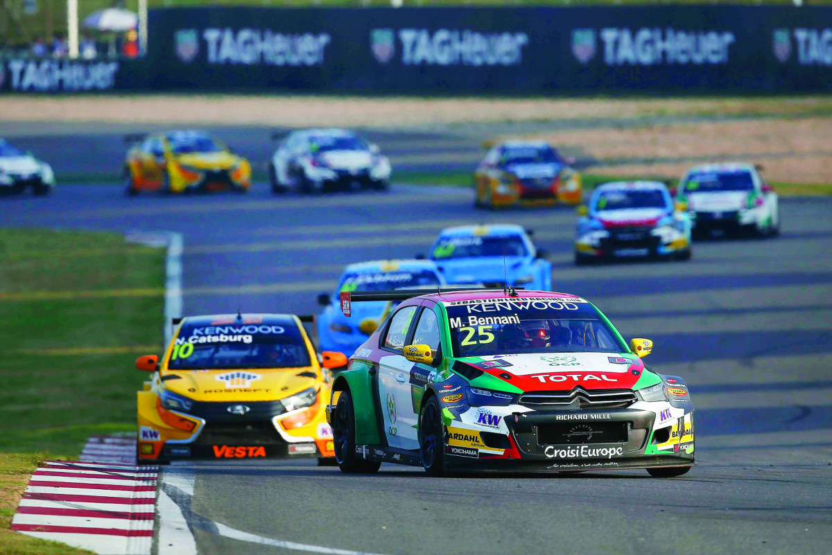 2016 Champion Bennani Mehdi (front) in action during the 2016 FIA WTCC World Touring Car Championship in this September 23 file photo.