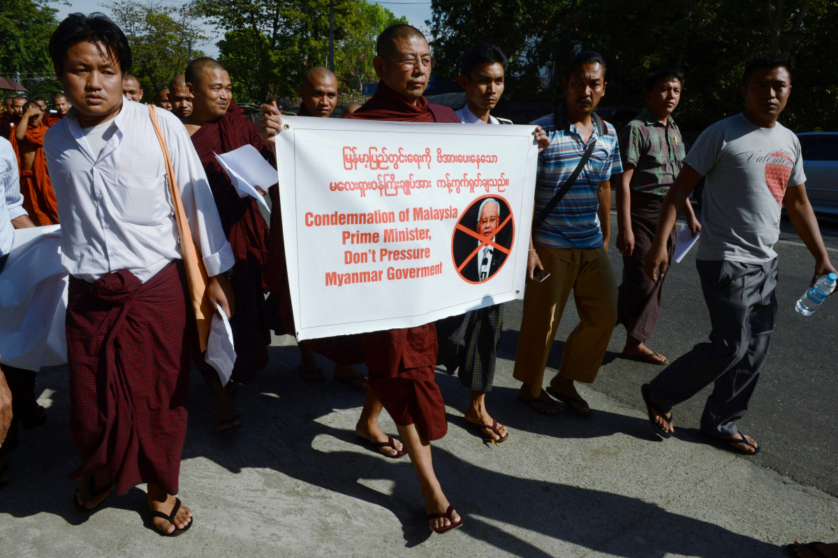 A group of Myanmar Buddhist monks stage a protest outside the Malaysian embassy in Yangon on December 3, 2016 to denounce Malaysia's Prime Minister Najib Razak's support for the persecuted Muslim Rohingya minority. Malaysia accused Myanmar of engaging in 