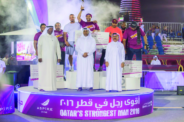 Qatar’s Strongest Man 2016 Champion Fahad Al-Haddad along with other Qatari participants and AZF officials during the award ceremony.