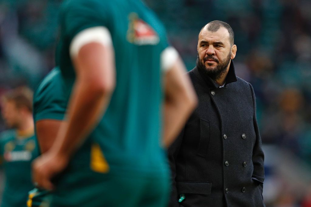 Australia's coach Michael Cheika watches as his players warm up ahead of the international rugby union test match between England and Australia at Twickenham stadium in south-west London on December 3, 2016. / AFP / Adrian DENNIS
