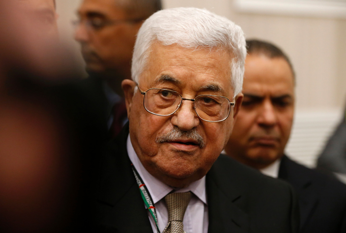 Palestinian president Mahmud Abbas (C) arrives to cast his vote at the Muqataa, the Palestinian Authority headquarters, in the city of Ramallah in the Israeli occupied West Bank, on December 3, 2016. Abbas's Fatah party held a vote for members of its ruli