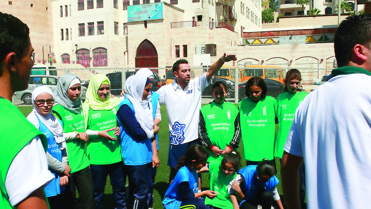 Nasser Al Khater, the Assistant Secretary General for Tournament Affairs at the Supreme Committee for Delivery & Legacy (SC). CENTRE: Legendary former Barcelona and Spain midfielder Xavi Hernandez (also right), now playing for Qatar's Al Sadd, is seen in 