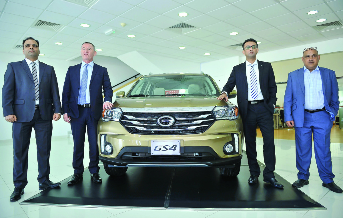 Faisal Sharif, Managing Director, (second right) Andrew Parrott (second left), Head of Sales and Marketing; and other officials during the launch of the new GS4 at  GAC Motor showroom yesterday.  Pic: Baher Amin/The Peninsula
