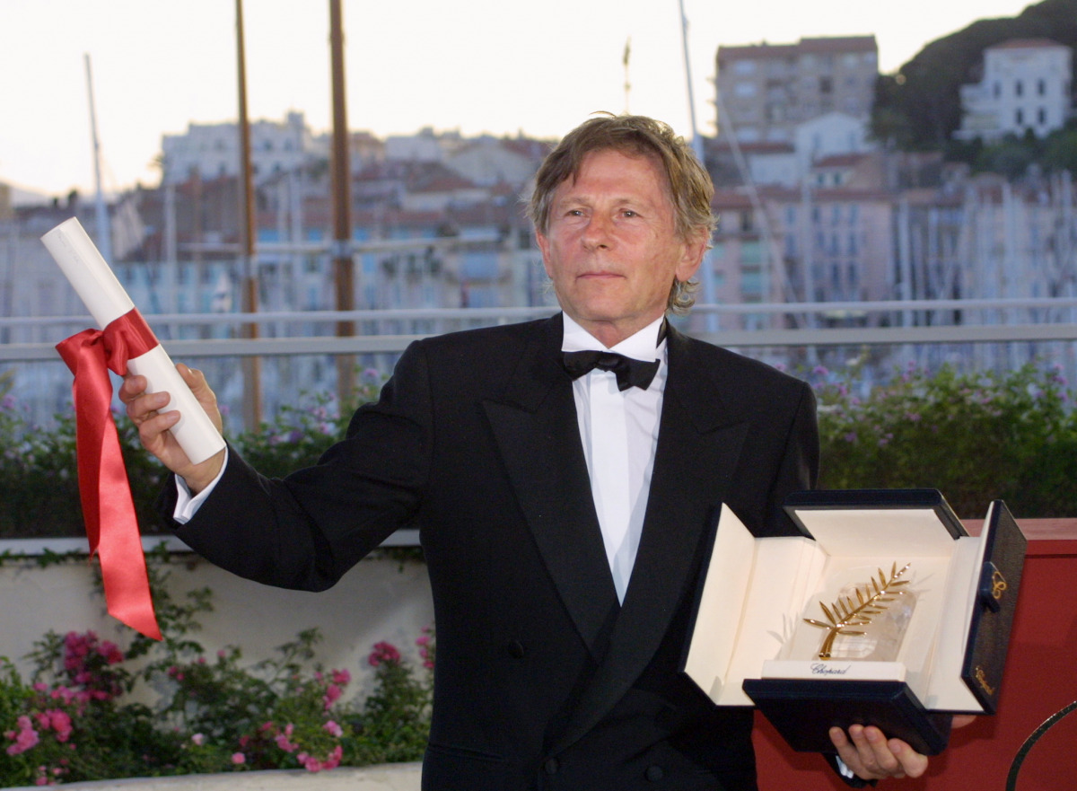 French, Polish born, director Roman Polanski posing for photographers after being awarded with the Golden Palm for his film 