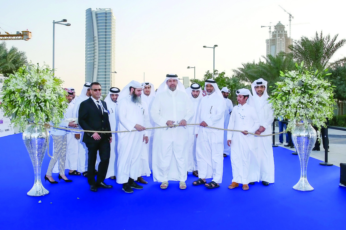 H E Sheikh Ahmed bin Jassim Al Thani, Minister of Economy an Commerce, cutting the ceremonial ribbon to mark the opening of Qatar International Boat Show, yesterday.