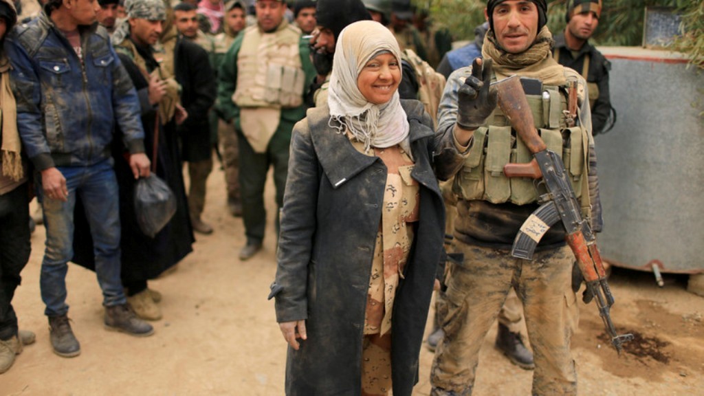 Miaad Madaad, the only female member of the Lions of the Tigris, a group of Sunni Arab fighters and part of PMU poses during a pause in a military operation against ISIS in Shayyalah al-Imam, Iraq November 30, 2016. (Reuters)