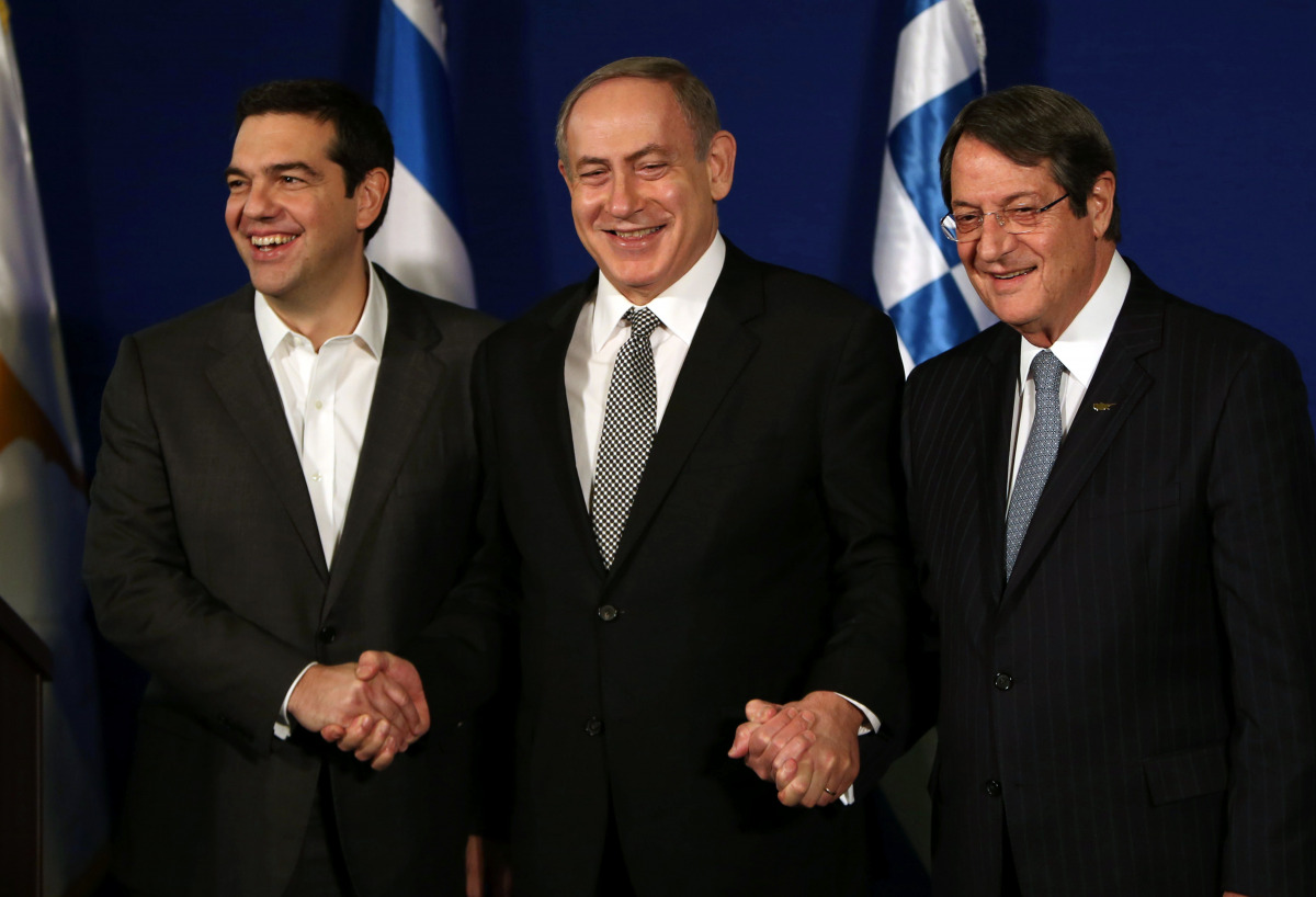 Israeli Prime Minister Benjamin Netanyahu (C) hosts Greek Prime Minister Alexis Tsipras (L) and Cypriot President Nicos Anastasiades during a trilateral meeting in Jerusalem to discuss eastern Mediterranean oil and gas on December 8, 2016. AFP / GALI TIBB