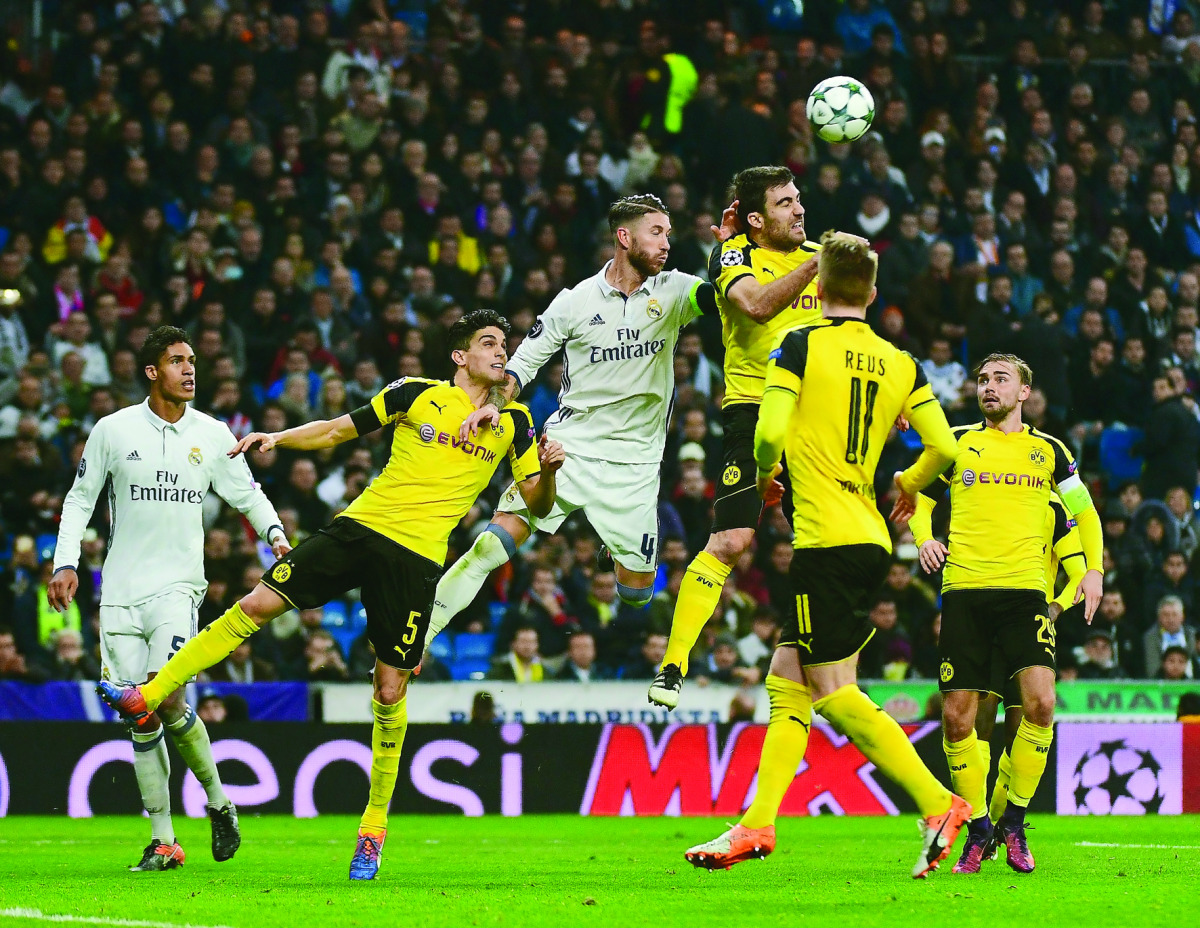 Real Madrid's Sergio Ramos (third left) vies for the ball with Borussia Dortmund's Sokratis (fourth left) during their UEFA Champions League match at the Santiago Bernabeu 
Stadium in Madrid, Spain on Wednesday.