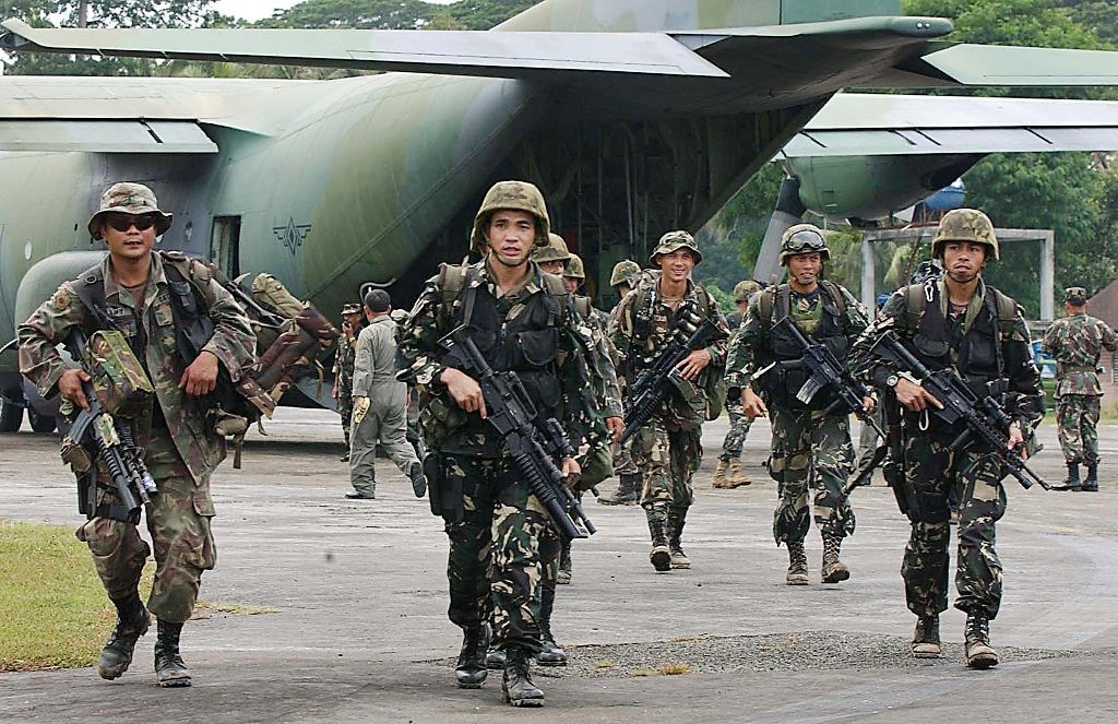 US-trained Philippine Army troops arrive in Jolo island for deployment against Abu Sayyaf rebels on August 24, 2002, as part of a government campaign that over decades has weakened but not eliminated the movement (AFP Photo/Romeo Gacad)