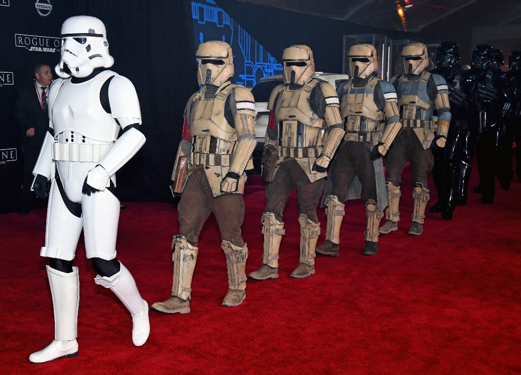 Stormtrooper characters march down the red carpet at the premiere of Walt Disney Pictures and Lucasfilm's 