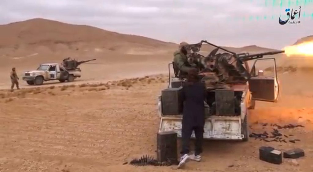 A still image taken on December 11, 2016 from a video released by Islamic State-affiliated Amaq news agency on December 10, 2016, purports to show Islamic State fighters advancing over the Hayan mountain south of Palmyra. 