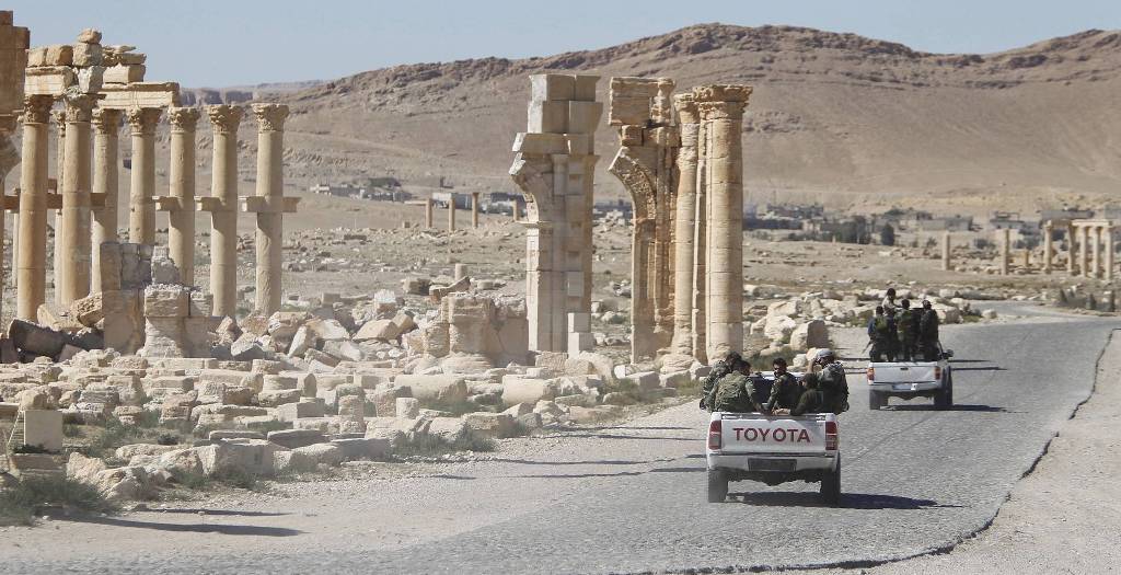 Syrian army soldiers drove through the historic city of Palmyra in April. PHOTO: REUTERS.