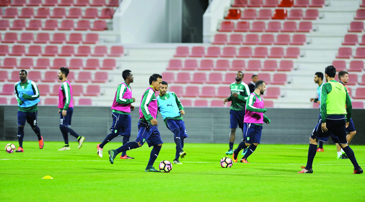 Al Ahli Saudi FC players train at the Al Arabi SC Stadium in Doha yesterday, ahead of their 'Match of the Champions' encounter against Barcelona. The game takes place at the Al Gharafa Stadium in Doha tomorrow with the kick-off set for 7pm. 	      Picture