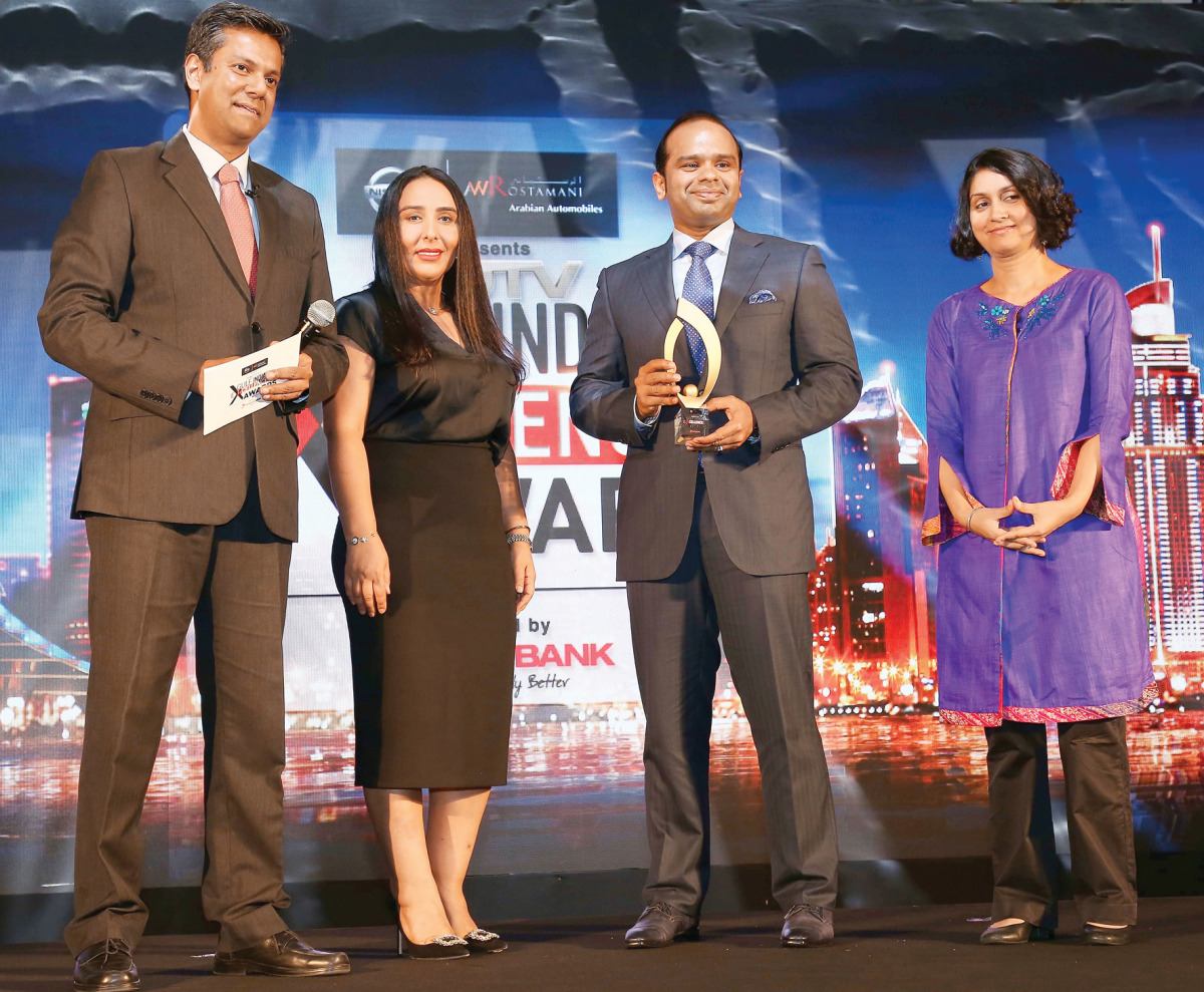 Adeeb Ahamed receiving the award.