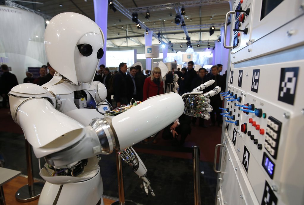 The humanoid robot AILA (artificial intelligence lightweight android) operates a switchboard during a demonstration by the German research centre for artificial intelligence at the CeBit computer fair in Hanover March, 5, 2013.REUTERS/Fabrizio Bensch