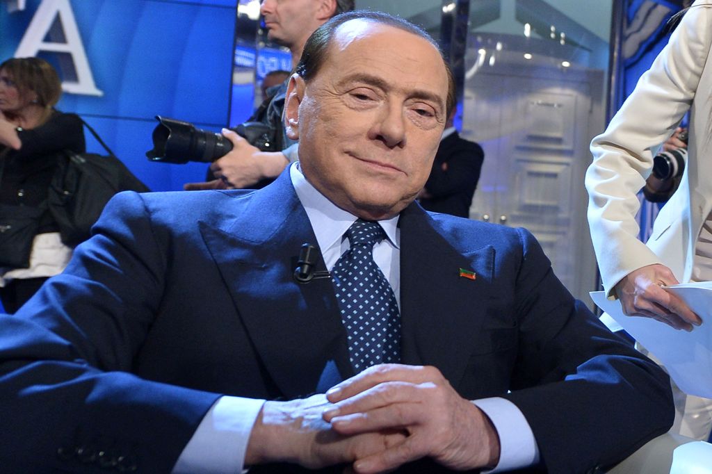 (FILES) This file photo taken on May 21, 2014 shows Italian former Prime Minister Silvio Berlusconi posing for photographers before the 