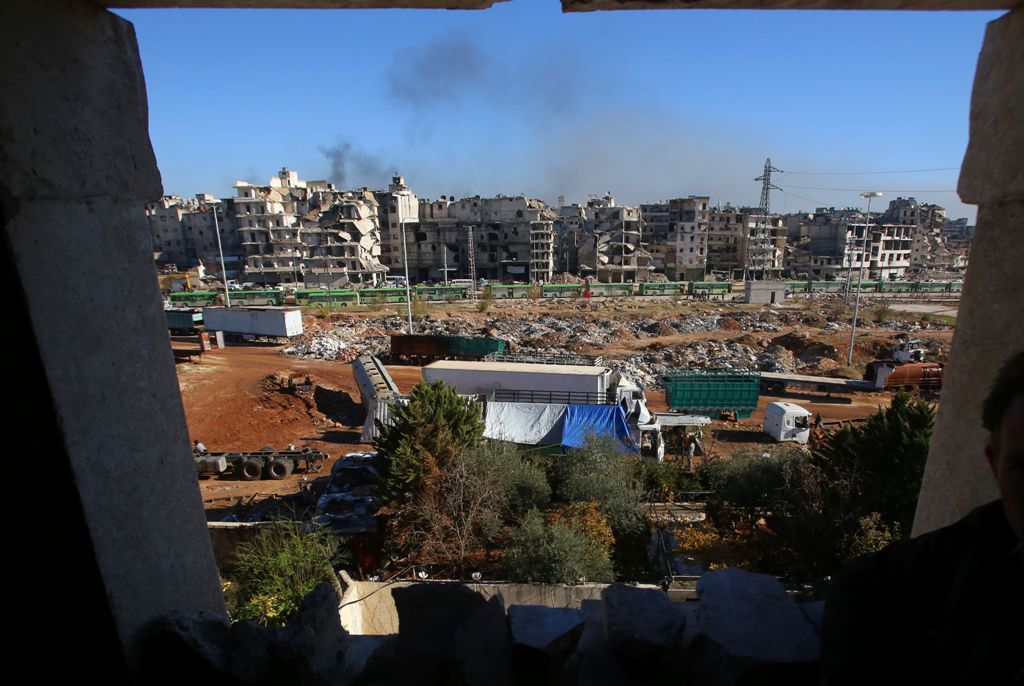 Buses which will be used to evacuate rebel fighters and their families from rebel-held areas of Aleppo are seen waiting on December 15, 2016. Russia, Syrian military sources and rebel officials confirmed that a new agreement had been reached after a first