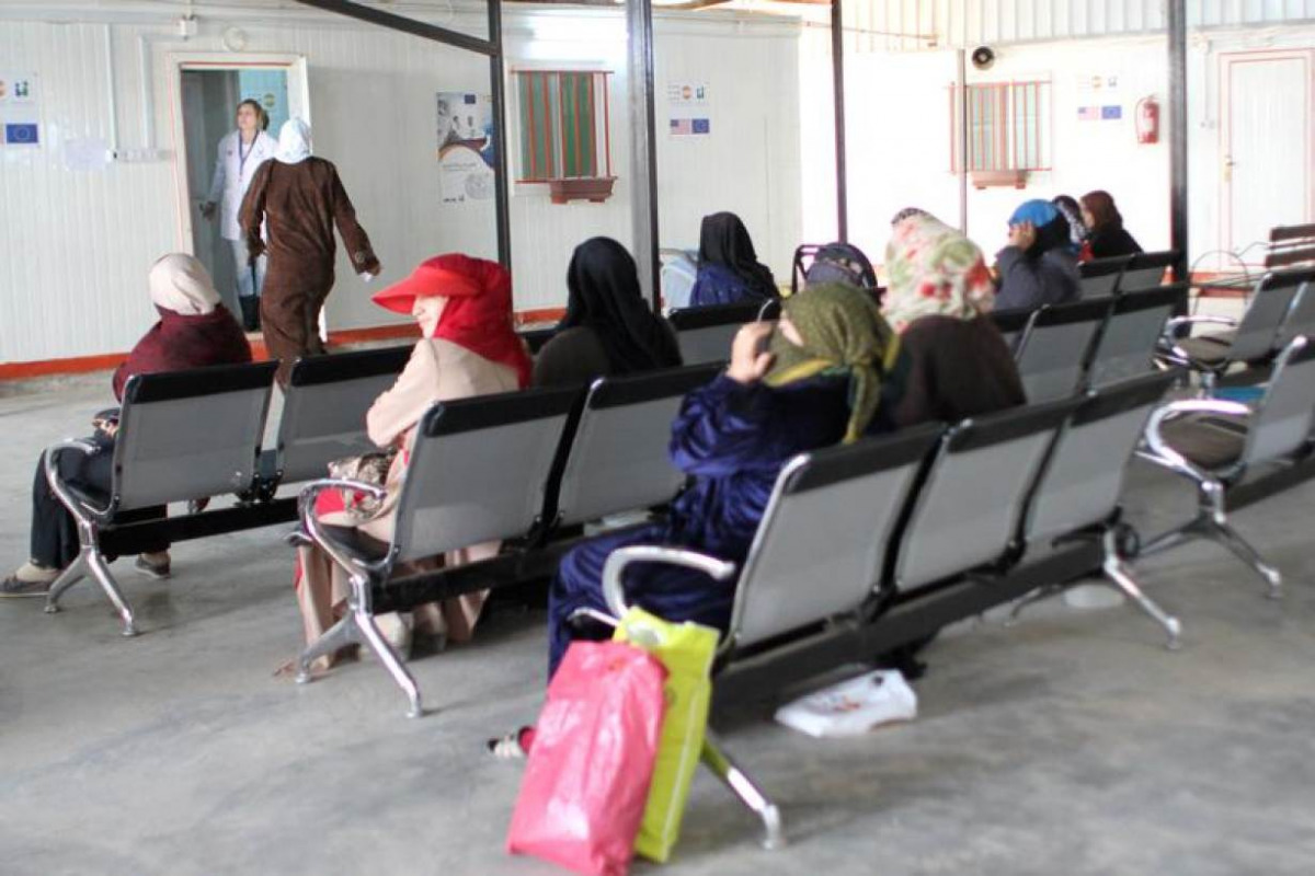 Syrian women sit in the waiting area to see a female doctor at a maternity clinic run by United Nations Population Fund inside Jordan's Al Zaatari refugee camp, which houses nearly 80,000 Syrian refugees, in Mafraq, Jordan November 22, 2016. Lin Taylor/Th