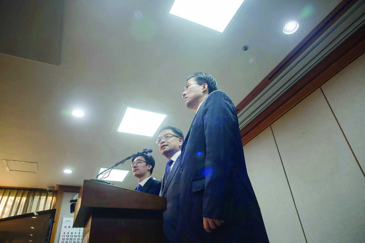 Lee Joong-Hwan (centre), a lawyer for South Korea's embattled President Park Geun-hye, gives a briefing after submitting a defence at the Constitutional Court in Seoul, yesterday. 