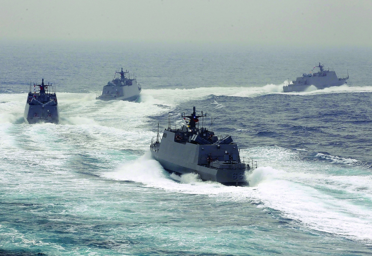 Taiwan navy fast attack boats take part in a military drill outside a naval base in Kaohsiung port, southern Taiwan, recently.