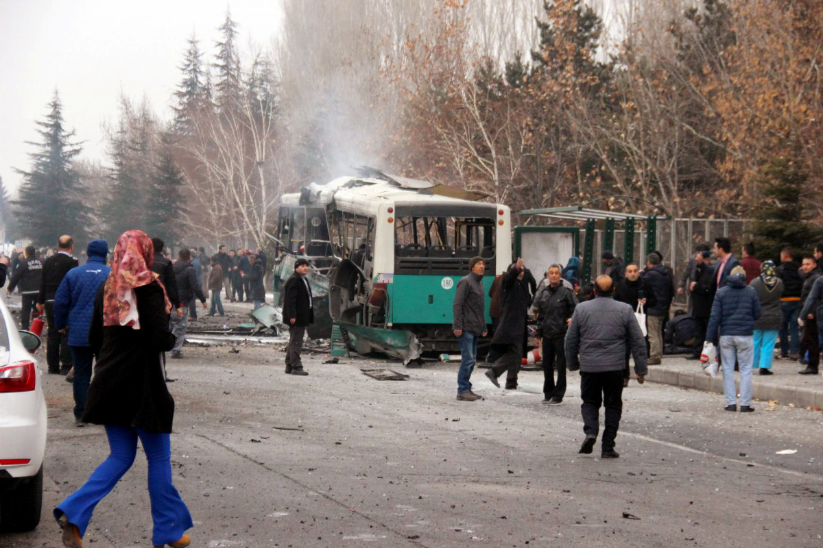 People react after a bus was hit by an explosion in Kayseri, Turkey, December 17, 2016. (Turan Bulut/Ihlas News Agency via REUTERS)