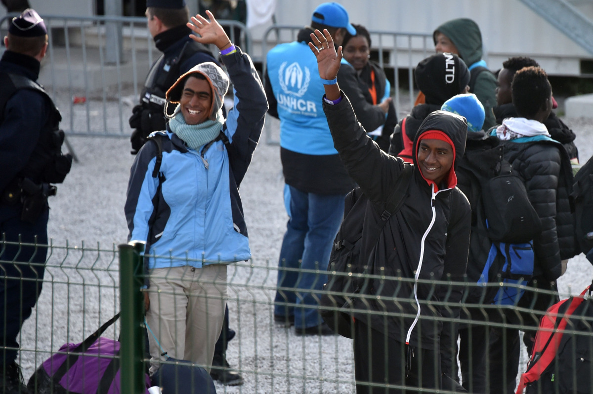 FILE PHOTO: Unaccompanied migrant minors from the demolished migrant camp in Calais wait to board a bus to be transferred to reception centres around France on November 2, 2016 in Calais, northern France (AFP) 