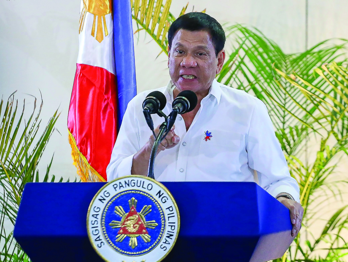 Philippine President Rodrigo Duterte during a press conference shortly after arriving from Singapore at Davao International Airport, yesterday.