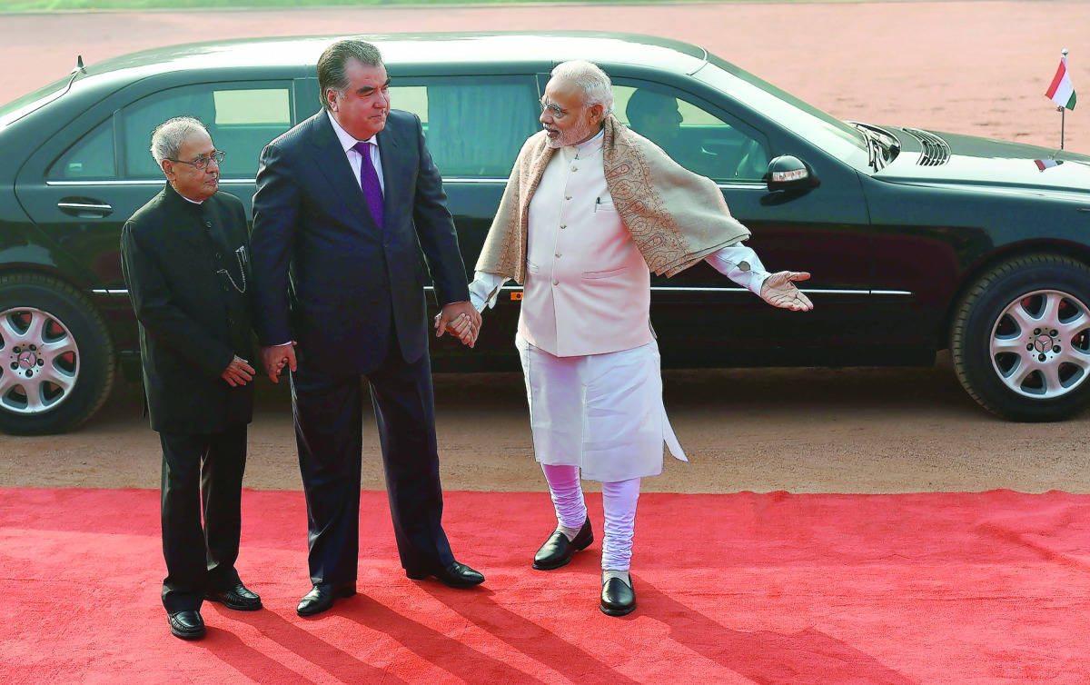 President of the Republic of Tajikistan Emomali Rahmon (centre) with President Pranab Mukherjee (left) and Prime Minister Narendra Modi during a ceremonial reception at The President's House in New Delhi yesterday.
