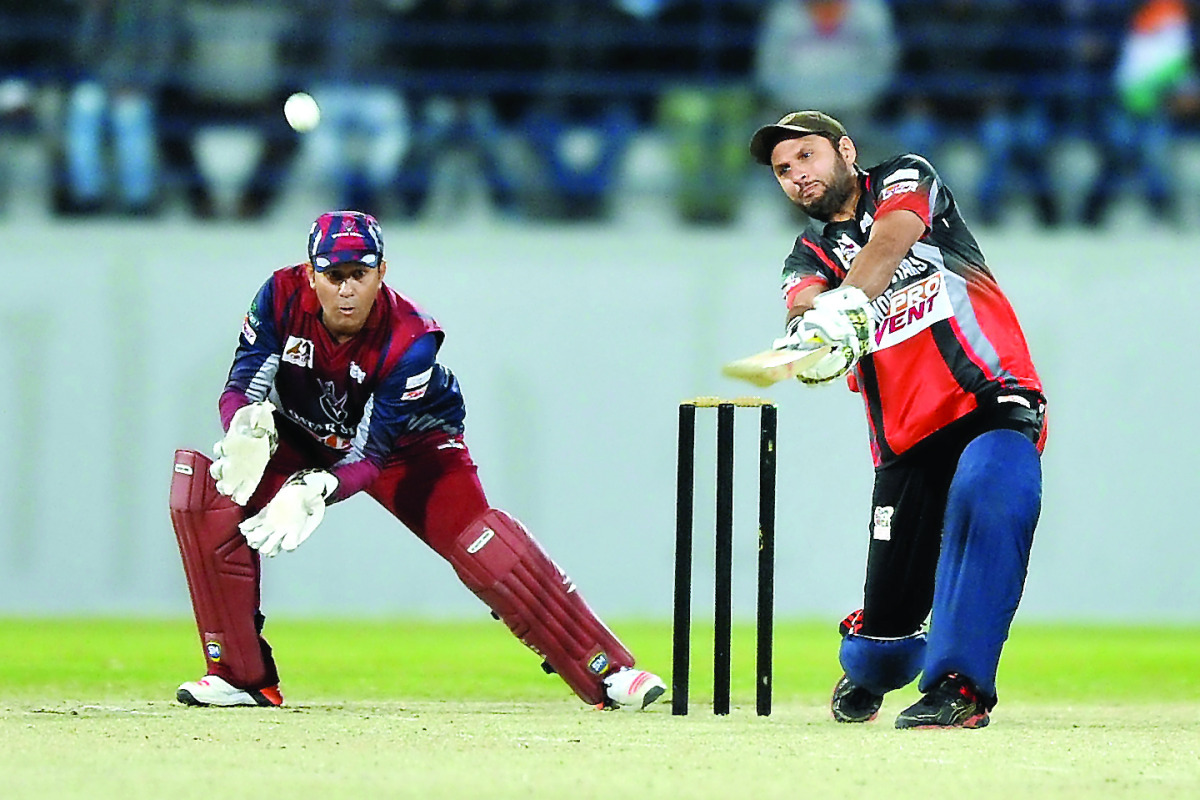 World Stars Captain Shahid Afridi plays a shot against Qatar Stars at the  held at the Asian Town Cricket Stadium on Friday. Pictures by Kammutty VP / The Peninsula