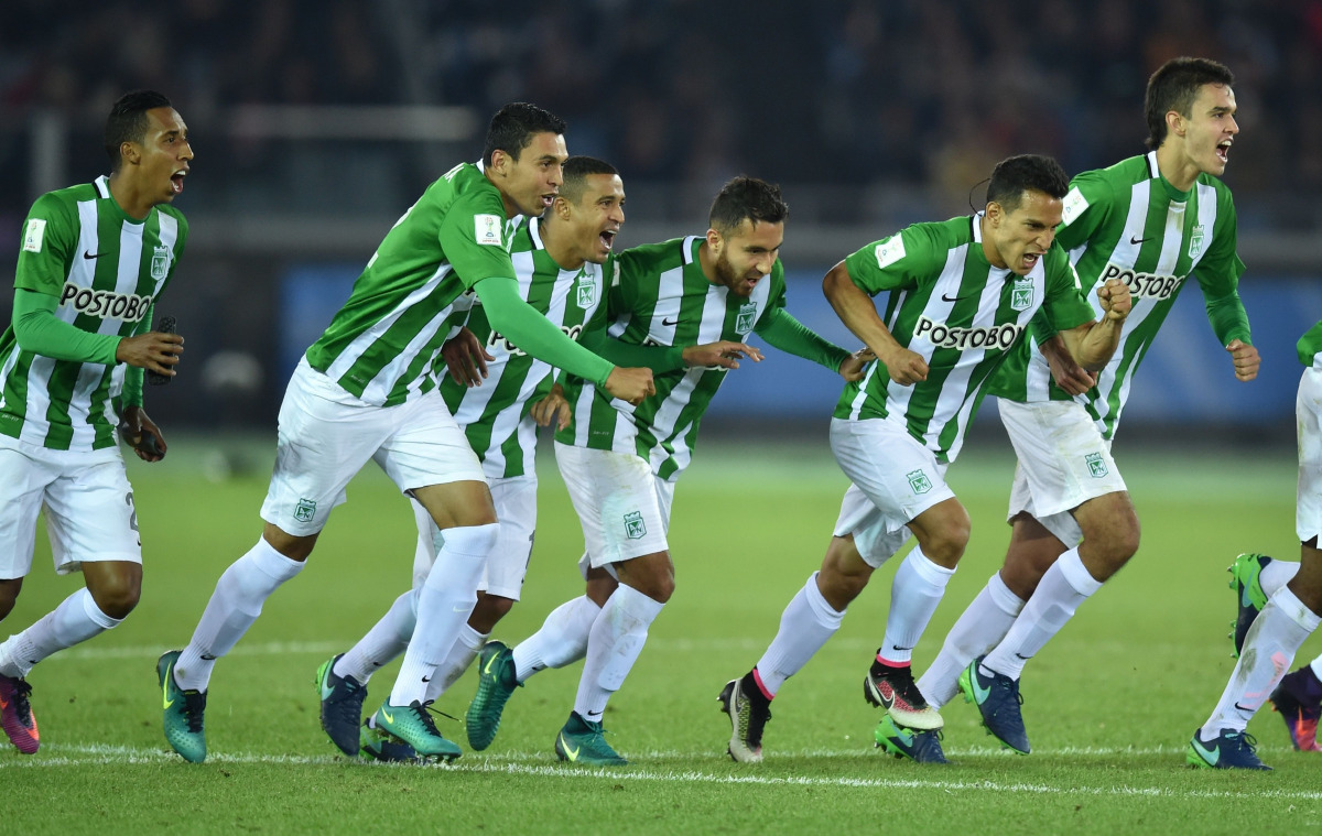 Players of Atletico Nacional celebrate their win over Club America following their penalty kick shootout at the Club World Cup third-place playoff football match between Atletico Nacional of Colombia and Club America of Mexico at Yokohama International st
