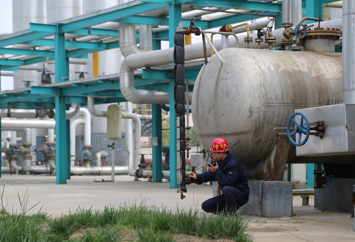 Employees work inside a factory of Pingmei Shenma Group in Baofeng County, Henan province, China, April 8, 2015. Picture taken April 8, 2015. To match Insight CHINA-DEBT/SOE China Daily/via REUTERS 
