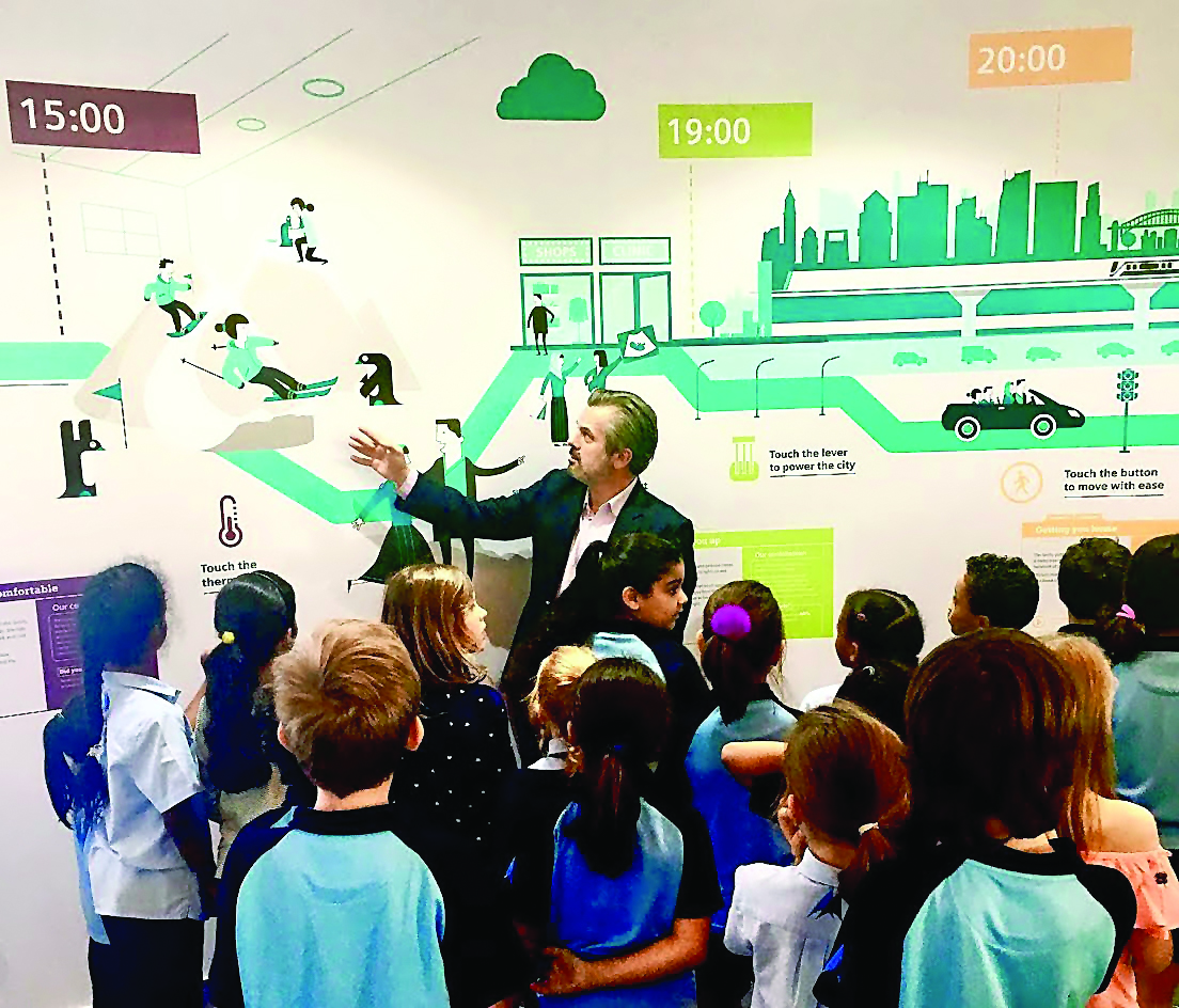 A Siemens official with school children at the centre.