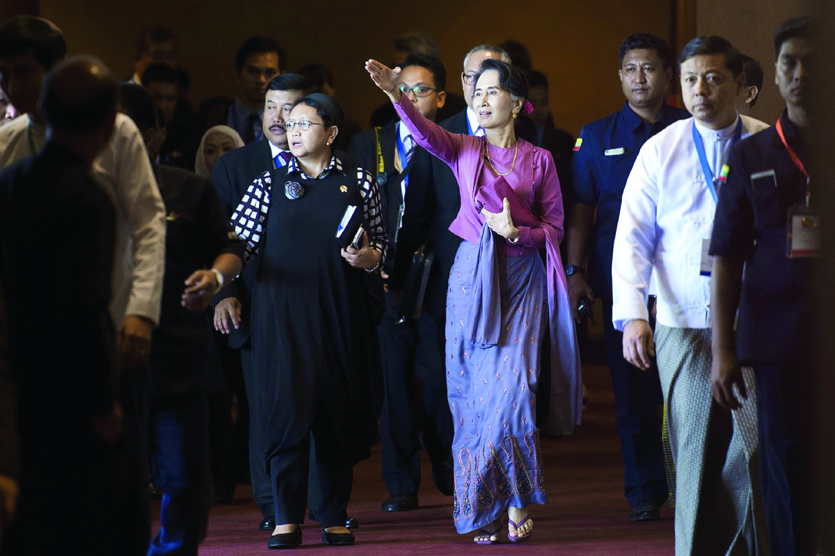 Indonesia's Foreign Minister Retno Marsudi (centre left) and Myanmar State Counsellor and Foreign Minister Aung San Suu Kyi attend the Association of Southeast Asian Nations (Asean) Foreign Ministers' meeting in Yangon, yesterday. 