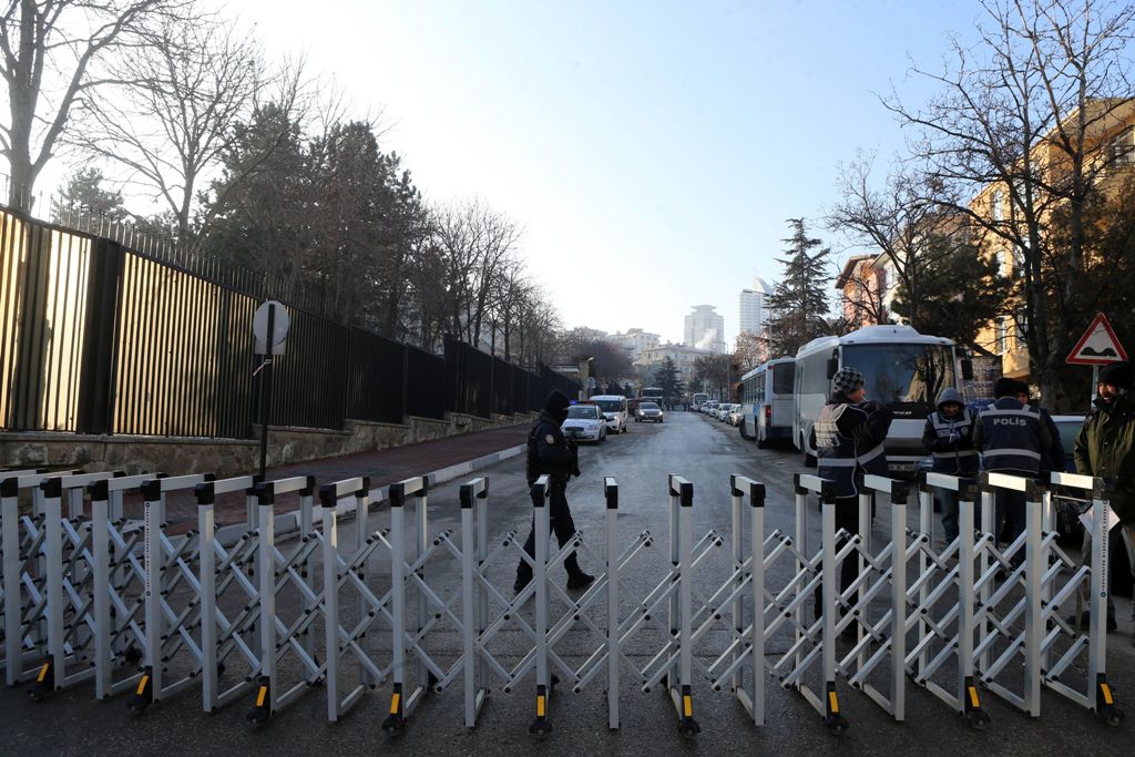 Turkish police officers stand guard outside the Russian Embassy in Ankara on December 20, 2016, a day after the assassination of the Russian ambassador in the Turkish capital. A Turkish policeman crying 