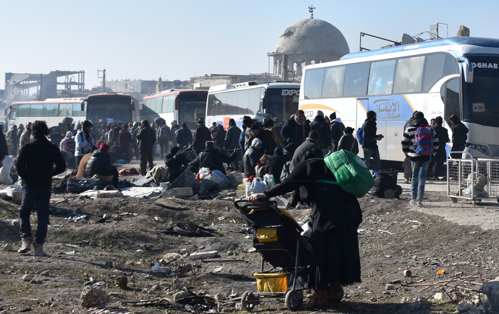 ALEPPO, SYRIA - DECEMBER 20: Civilians from East Aleppo, which was under siege by Assad regime forces and its supporter foreign terrorist groups, wait for their evacuation at Amerriye region of Aleppo, Syria on December 20, 2016. ( Mustafa Sultan - Anadol