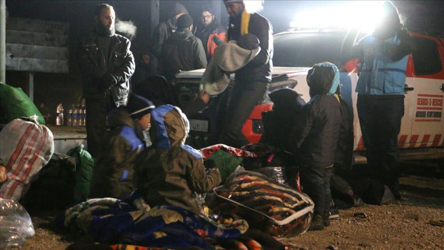 Syrians wait to be evacuated from the east part of Aleppo that had been under siege by Assad Regime forces and its supporter foreign terrorist groups at a crossing point at Rashideen town of Aleppo in Syria on December 19, 2016. ( Aref Watad - Anadolu Age