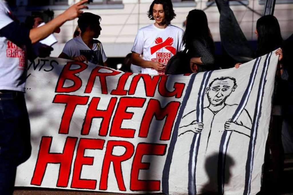 Refugee advocates hold a banner during a protest in central Sydney, Australia, on Oct 5, 2016, calling for the closure of the Australian detention centres located in Nauru and Manus Island. PHOTO: REUTERS.