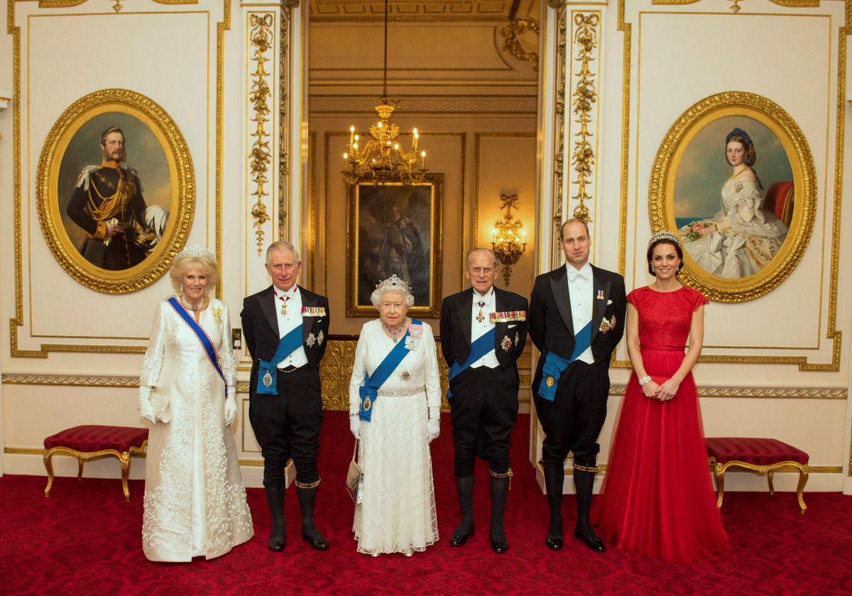The Duchess of Cornwall, the Prince of Wales, Queen Elizabeth II, the Duke of Edinburgh, and Duke and Duchess of Cambridge (L-R) arrive for the annual evening reception for members of the Diplomatic Corps at Buckingham Palace in London, Britain December 8
